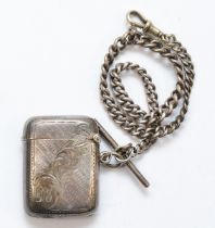 An Edward VII silver rounded rectangular vesta case, by Joseph Gloster, Birmingham 1903, on a silver