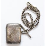 An Edward VII silver rounded rectangular vesta case, by Joseph Gloster, Birmingham 1903, on a silver