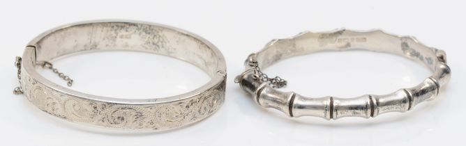 A vintage silver bamboo hinged bangle, and another chased decorated example, Birmingham 1967, 26gm.