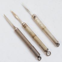 Three vintage silver cased tooth picks,