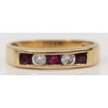 A 9ct gold ruby and brilliant cut diamond dress ring, O, 2.6gm.