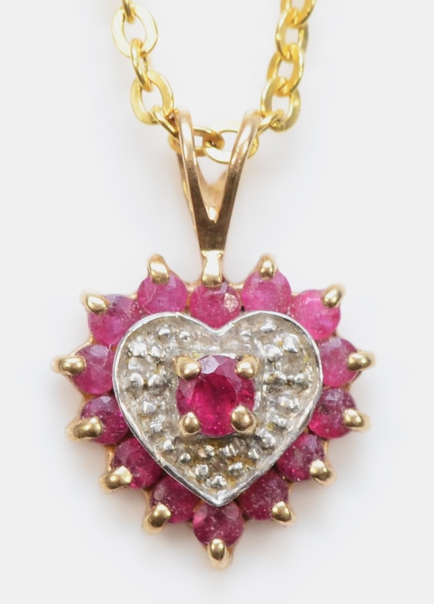 A 9ct gold ruby and eight cut diamond heart shaped pendant, on 9kt gold chain, 16mm, 1.7gm.