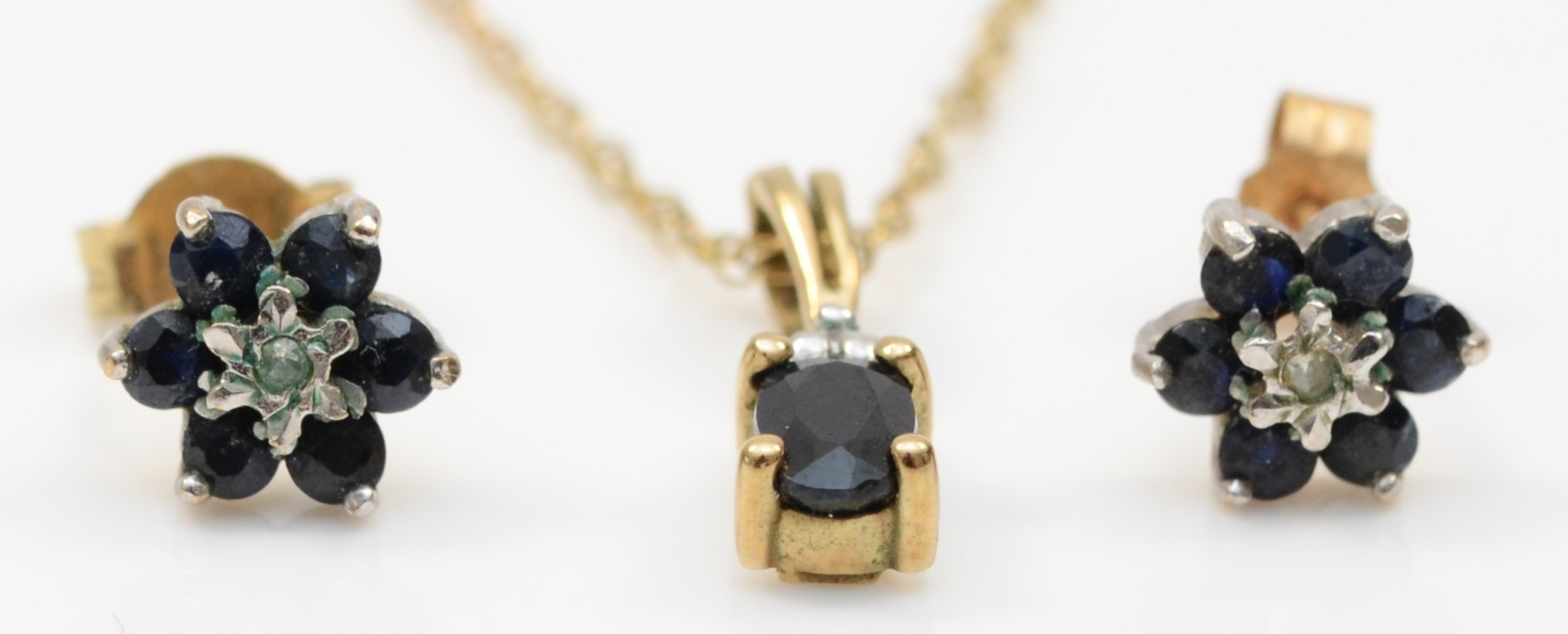 A 9ct gold sapphire and eight cut diamond pendant, on 375 gold chain, 13mm, together with a pair - Bild 2 aus 2