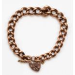A 9ct rose gold curb link heart padlock clasped bracelet, 47gm.