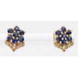 A pair of gold sapphire and brilliant cut diamond flower stud earrings, unmarked, butterfly backs