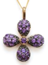 A 9ct gold amethyst flower pendant, on 375 gold chain, 23 x 18mm, 2.9gm.