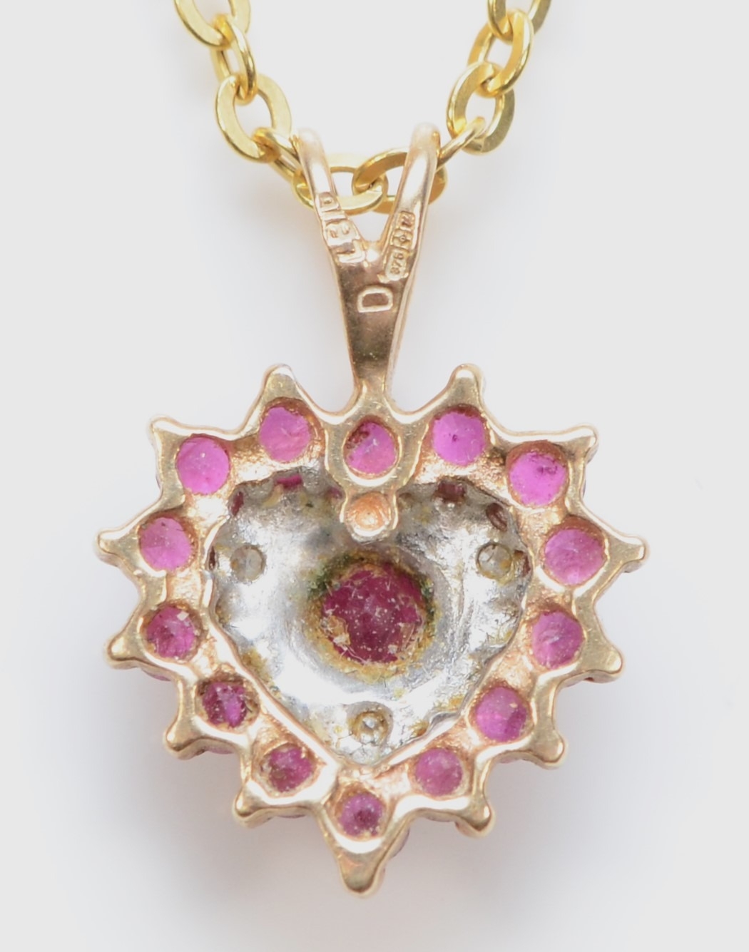 A 9ct gold ruby and eight cut diamond heart shaped pendant, on 9kt gold chain, 16mm, 1.7gm. - Image 2 of 2