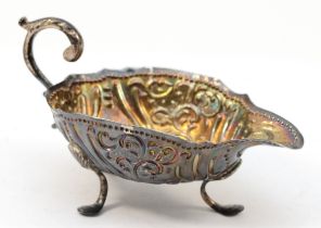 A George III silver embossed sauce boat, London 1770, 10 x 6cm, 49gm.