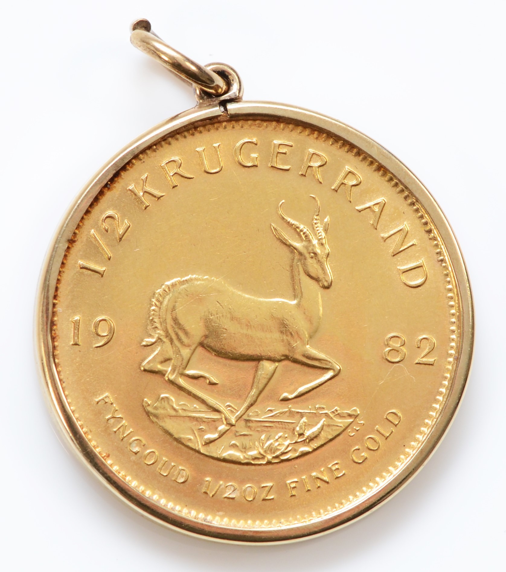 A 1982 1/2 gold Krugerrand, in a gold mount, 18.3gm. - Image 2 of 2