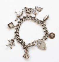 A silver heart padlock clasp charm bracelet, with charms to include a gray hound, 65gm.