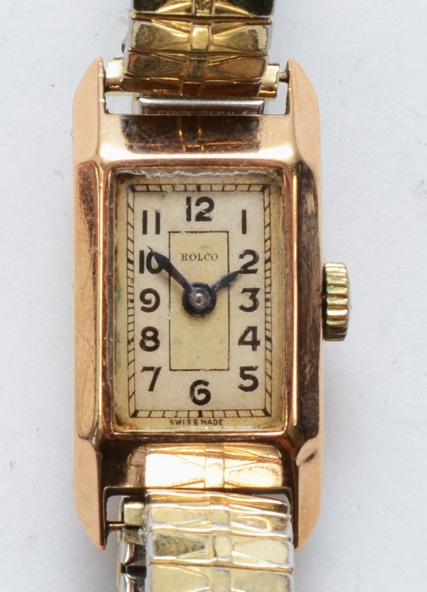 Rolco, A 9ct gold cased rectangular Ladies wrist watch, the silvered dial set with Arabic