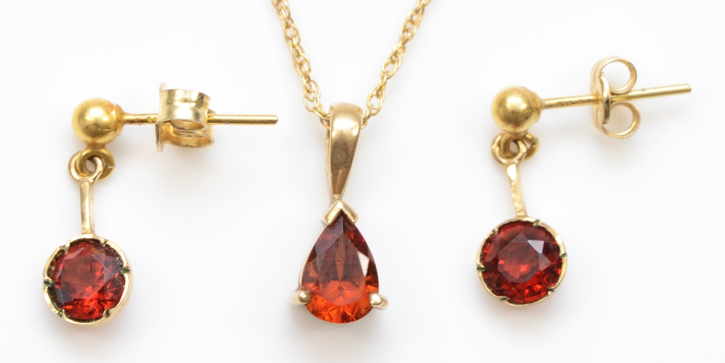 A gold garnet pendant, unmarked, on a 375 gold chain, 13mm, together with a pair of 9ct gold