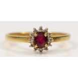 A 750 gold synthetic ruby and diamond cluster ring, N, 2gm.