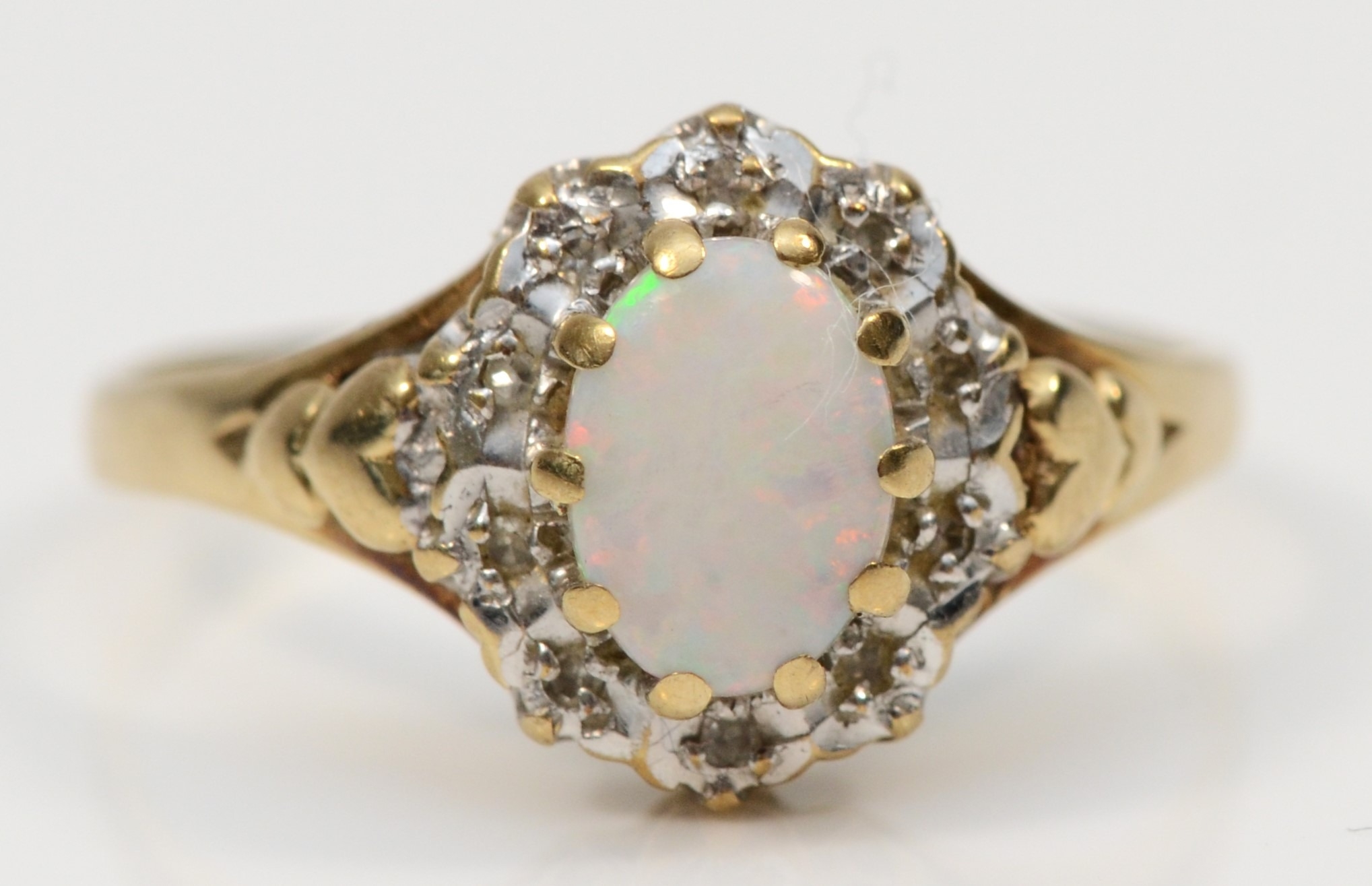 A 9ct gold opal and eight cut diamond dress ring, O, 1.9gm.