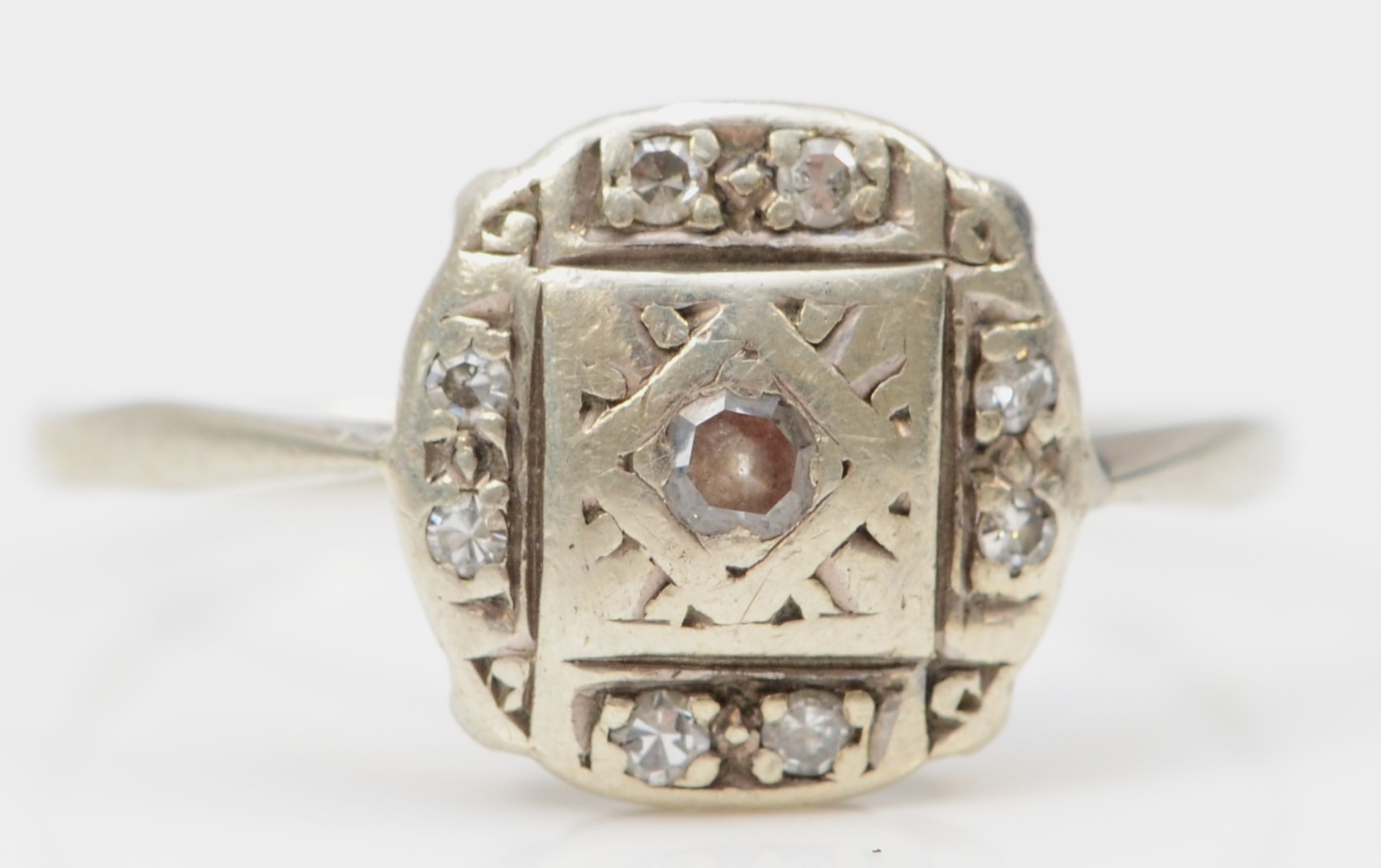 A 9ct white gold eight cut diamond dress ring, P, 1.4gm.