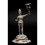 A Victorian cast silver figural candlestick, by C.T Fox & G Fox, London 1865, modelled as an