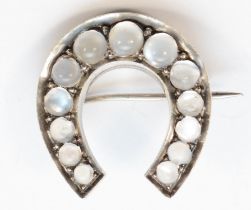 A Victorian silver moonstone horseshoe brooch, unmarked, 28 x 30mm, 10gm.