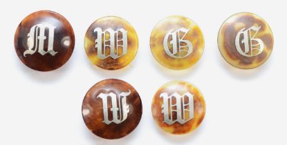 Three pairs of Edwardian tortoise shell and silver inlay dress buttons, monogrammed.