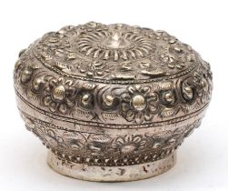 A continental silver circular embossed pot, with floral decoration, rubbed marks to base, 5 x 7cm,