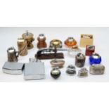 A collection of mid 20th century and later cigarette table lighters, to include novelty examples,