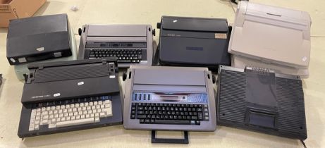 A collection of eight 20th century typewriters, makers to include Sharp, Panasonic, Triumph-Adler