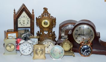 A collection of early 20th century and later clocks, to include mantel, carriage, traveling alarm