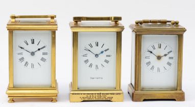 Three mid 20th century brass carriage clocks, having 8 day movements. (3)