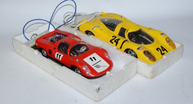 Two 1960s toy model racing cars comprising Porsche Carrera and Porsche 917, of plastic