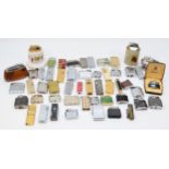 A collection of mid 20th century and later cigarette lighters, pocket and table, gas and petrol