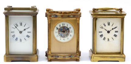 An early 20th century French carriage clock, together with two later English examples, 12cm tall. (