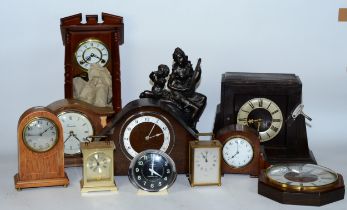 A collection of early 20th century and later clocks, to include mantel, carriage, traveling alarm