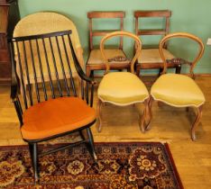 A harlequin set of six chairs, comprising a pair of Edwardian balloon back dining chairs, a pair