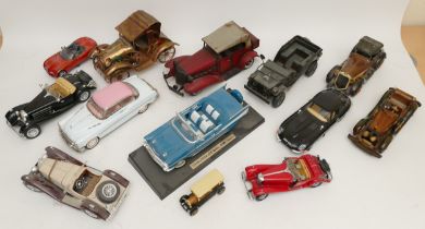 A collection of diecast model cars, together with tinplate model vehicles, boxed and loose in two