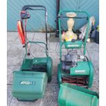 A Qualcast classic petrol driven lawn mower, together with a Atco windsor 145 electric lawn mower