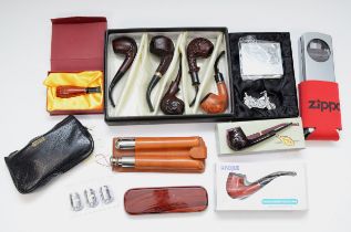 A collection of smoking related items, to include a cased Feng Shun set of five tobacco pipes, cased