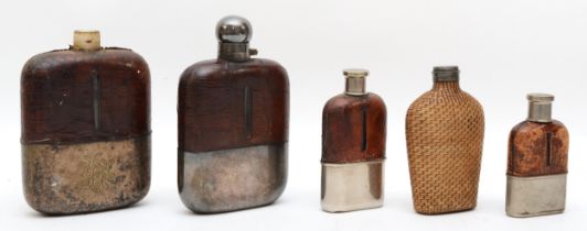 Four mid 20th century silver plated and leather hip flasks, largest 17cm, together with a rattan