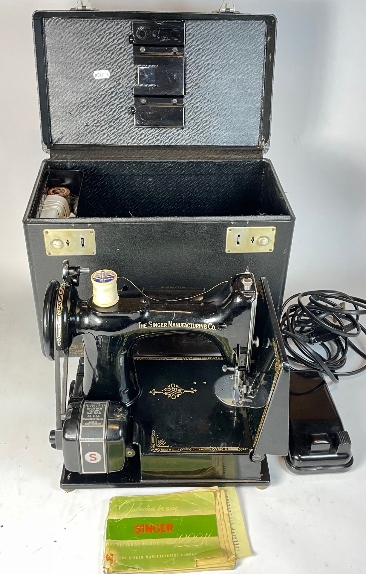 An early 20th century electric Singer sewing machine, possible model 221K, complete with original c