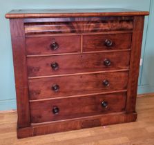 A Victorian mahogany chest of drawers, shaped upper frieze drawer, two short over three long