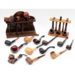 A collection of tobacco pipes, makers to include E.A Carey, Sharrow, Courrieu, together with two