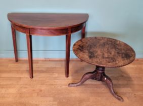An Edwardian mahogany demilune hall table, together with an oak tripod side table, 68cm diameter. (