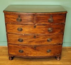 An Edwardian mahogany bow fronted chest of drawers, having two short over three long graduated