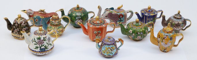 Franklin Mint; A set of twelve miniature cloisonne teapots 'Jewels Of The Ming Dynasty' featuring