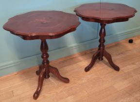 A pair of Italian style inlaid occasional tables, raised on turned central column and three outswept