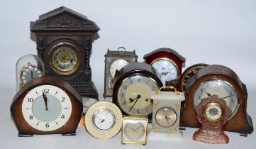 A collection of early 20th century and later clocks, having manual and quartz movements, to