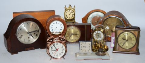 A collection of early 20th century and later clocks, to include mantel, carriage, traveling alarm