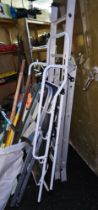 Various garden tools and three ladders