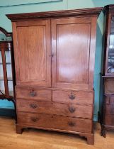A late 19th century converted mahogany linen-press, the upper part lacking shelves, enclosed by a