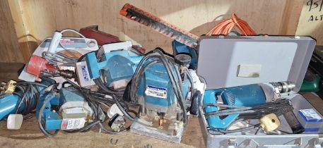 A collection of power tools, to include Makita Router 3600B, Jigsaw 4300BA, Belt Sander 9900B and