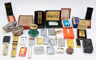 A collection of mid 20th century and later cigarette lighters, pocket and table, gas and petrol