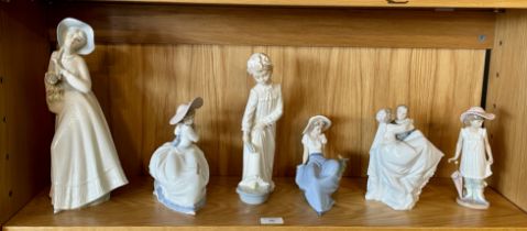 A collection of six porcelain Nao figurines, tallest 30cm. (6)